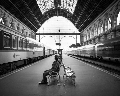 Person reading on public transportation with comfortable posture